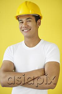AsiaPix - Man wearing hardhat, smiling at camera