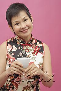 AsiaPix - Mature woman cheongsam, holding Chinese tea cup