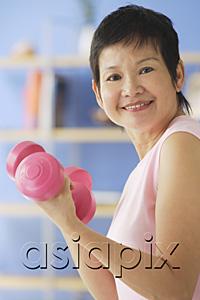 AsiaPix - Mature woman holding dumbbells
