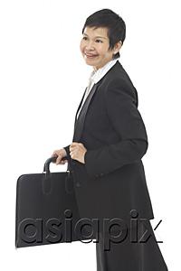 AsiaPix - Businesswoman with briefcase, looking away, smiling