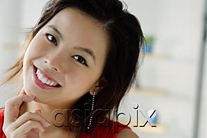 AsiaPix - Young woman smiling, head shot