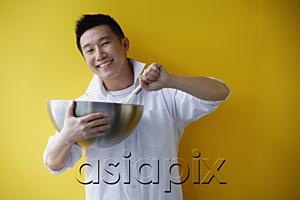 AsiaPix - Man holding bowl and whisk