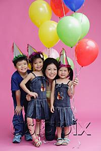 AsiaPix - Mother and three children, posing with balloons