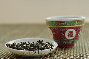 AsiaPix - Plate of Tea leaves with Chinese teacup
