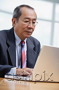 AsiaPix - Businessman with laptop