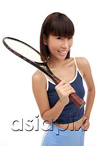 AsiaPix - Young woman with tennis racket, smiling at camera