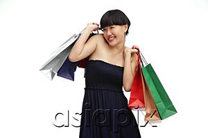 AsiaPix - Young woman in black dress with shopping bags