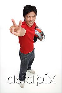 AsiaPix - Young man with motorcycle helmet, making peace sign