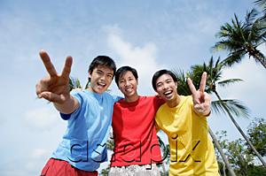 AsiaPix - Men with arms around each other, looking at camera, making peace sign