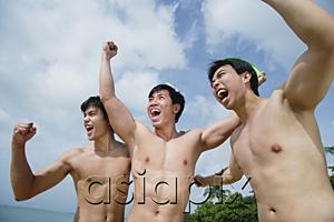 AsiaPix - Three shirtless men raising fists