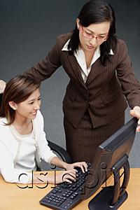 AsiaPix - Businesswomen looking at computer