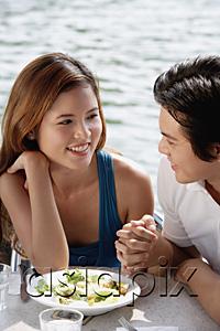 AsiaPix - Couple sitting at outdoor cafe, looking at each other