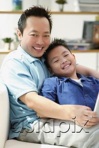 AsiaPix - Father and son smiling at camera, portrait