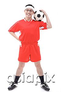 AsiaPix - Man in soccer uniform holding soccer ball on shoulder