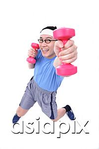 AsiaPix - Man using dumbbells, high angle view