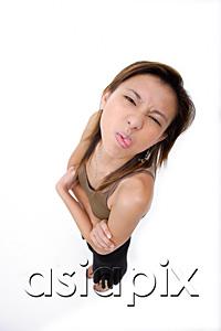 AsiaPix - Young woman sticking out her tongue, making a face