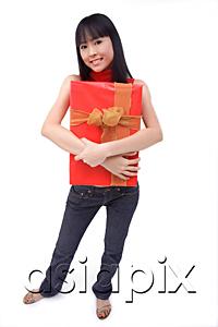 AsiaPix - Young woman embracing big red gift box