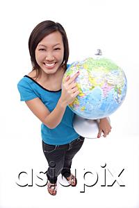 AsiaPix - Woman holding globe, smiling at camera