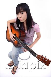 AsiaPix - Young woman with guitar