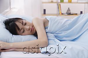 AsiaPix - Young woman sleeping in bed