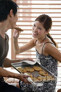 AsiaPix - Woman feeding man a cookie