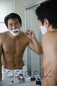 AsiaPix - Man shaving in bathroom