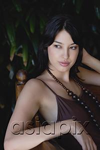 AsiaPix - Young woman in sleeveless top, looking away