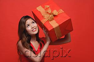 AsiaPix - Woman in red dress, holding wrapped gift box