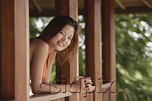 AsiaPix - Woman in balcony, smiling at camera