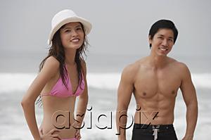 AsiaPix - Couple on beach, looking at camera, smiling
