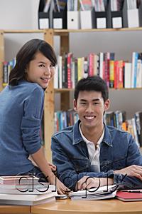 AsiaPix - Couple in library, looking at camera