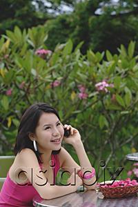 AsiaPix - Young woman the phone, smiling