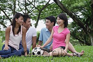 AsiaPix - Young adults sitting in park