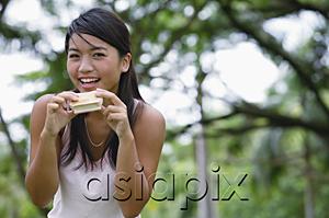 AsiaPix - Young woman eating ice cream