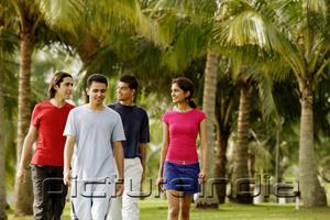 PictureIndia - Group of young adults walking in park