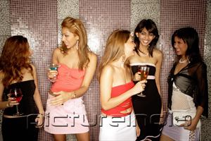 PictureIndia - Women standing with drinks, talking