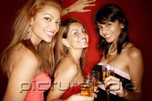 PictureIndia - Women looking at camera, holding drinks, smiling