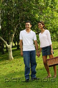 PictureIndia - Couple standing in park, holding hands