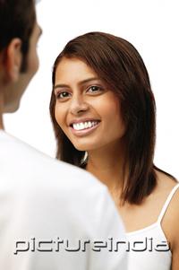 PictureIndia - Woman smiling at man in front of her