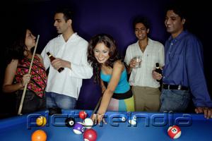 PictureIndia - Young adults playing pool and drinking beer