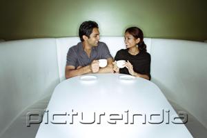 PictureIndia - Couple sitting side by side having tea