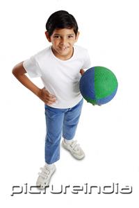 PictureIndia - Boy holding basketball, hand on hip