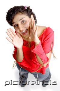 PictureIndia - Woman shouting, looking up at camera