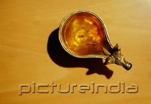PictureIndia - Still life of oil lamp, high angle view