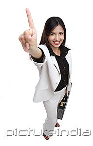 PictureIndia - Businesswoman with briefcase, one finger pointing upwards