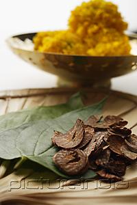 PictureIndia - betel nut and leaves with chrysanthemums in background