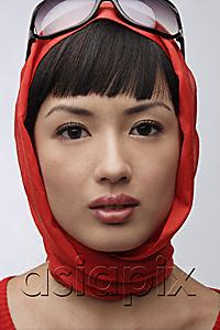 AsiaPix - Portrait of woman wearing red sweater, scarf and sunglasses