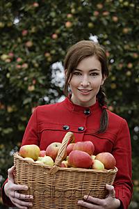 Mind Body Soul - Young woman with basket full of apples