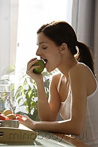 Mind Body Soul - Profile of young woman eating apple