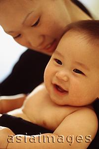 Asia Images Group - Mother looking at baby boy (3-9 months old) smiling